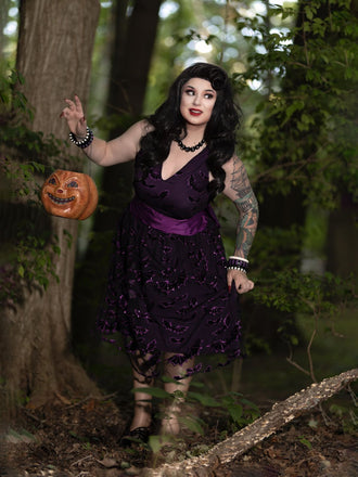 She slips into this Deep Purple 1950s Halloween Bat Bow Dress and suddenly it's a 1950s daydream