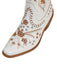 White shoe with brown floral embroidery on a white background