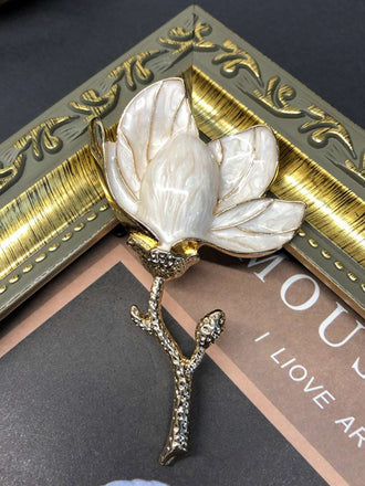 She finds her vintage story in this Enamel 3D Magnolia Flower Brooch