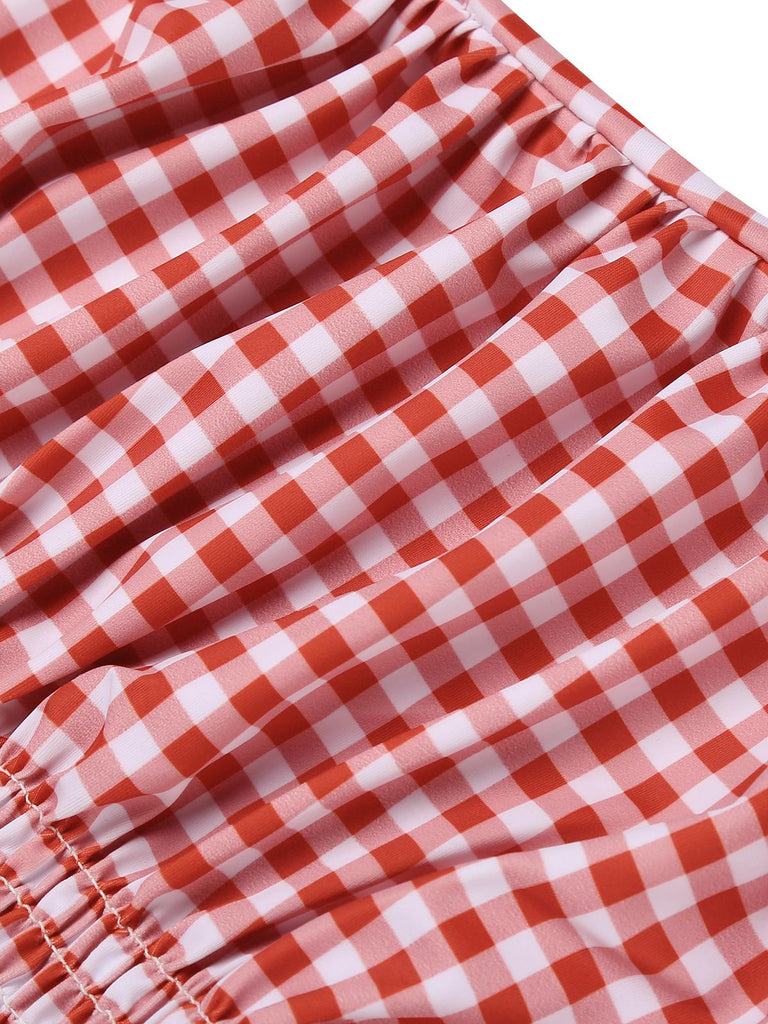 She's wearing Gingham 1950s Halter Bowknot One-piece Swimsuit and the whole beach remembers the 1950s