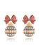 She adds this Glitter Bow & Bulbs Rhinestone Earrings and suddenly it's vintage perfection