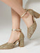 Gold glitter high heels on a neutral background