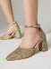Gold glitter high heels on a neutral background