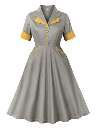 She slips into this Gray 1950s Lapel Pocketed Swing Dress and suddenly it's a 1950s daydream