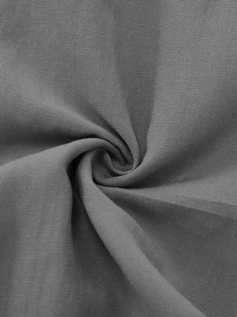 Gray halter dress fabric closeup displaying smooth texture and breathable material for comfort wear