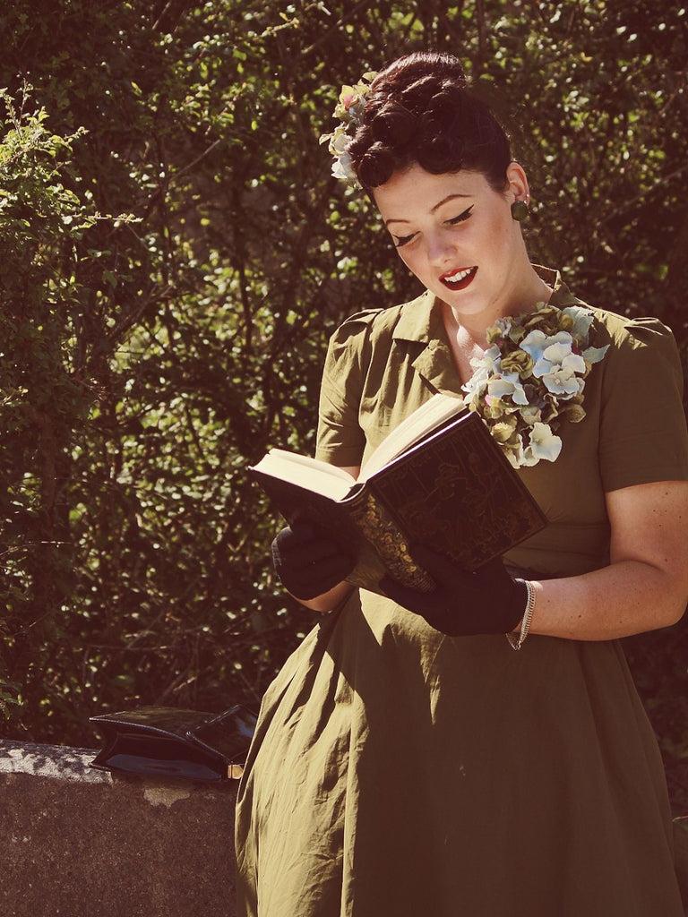 She slips into this Green 1940s Lapel Buttoned Solid Dress and suddenly it's a 1940s daydream
