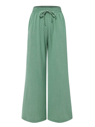She pairs this 2PCS 1940s White Lapel Blouse & Green Wrinkles Pants with confidence and 1940s charm