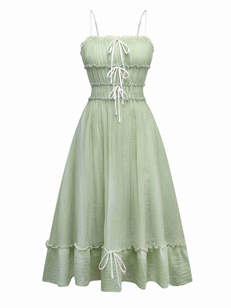 She slips into this Green 1940s Spaghetti Strap Bow-tied Dress and suddenly it's a 1940s daydream
