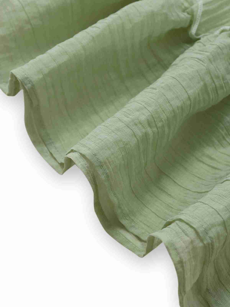 Green 1940s Spaghetti Strap Bow-tied Dress — a 1940s silhouette that turns sidewalks into runways