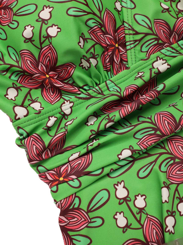 This Green 1940s V-Neck Floral Ruched-Waist Swimsuit carries 1940s vacation dreams in every stitch