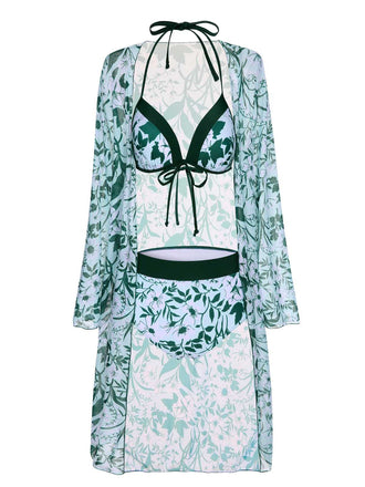 She's wearing Green 1950s Halter Plants Print Swimsuit & Cover-Up and the whole beach remembers the 1950s