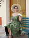 She slips into this Green 1950s Off-Shoulder Vintage Dress and suddenly it's a 1950s daydream
