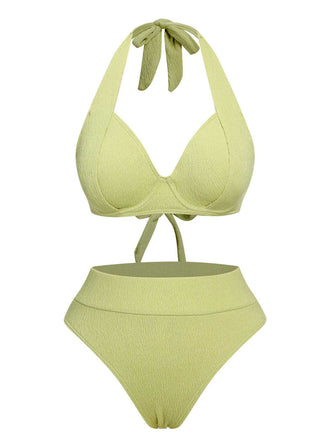 She's wearing Green 1960s Halter High-Waist Swimsuit and the whole beach remembers the 1960s