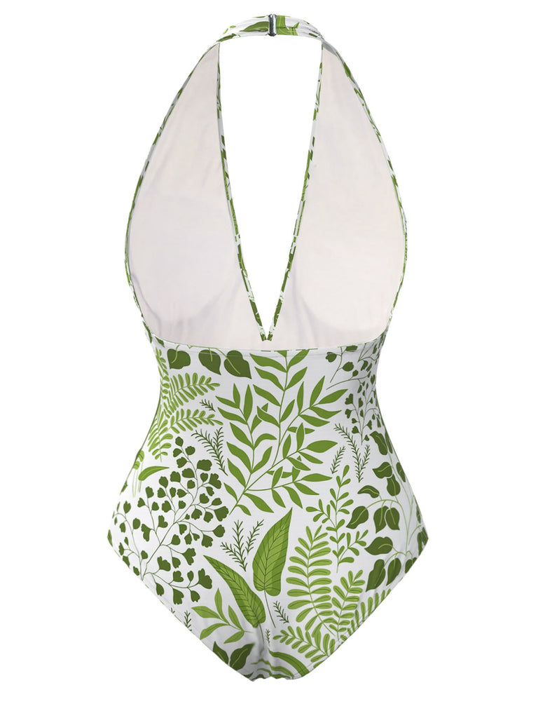 This Green 1960s Plant Print Halter One-Piece Swimsuit carries 1960s vacation dreams in every stitch