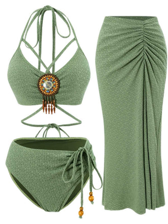 She's wearing Green 1970s Boho Beaded Bikini Set & Ruched Cover-Up and the whole beach remembers the 1970s