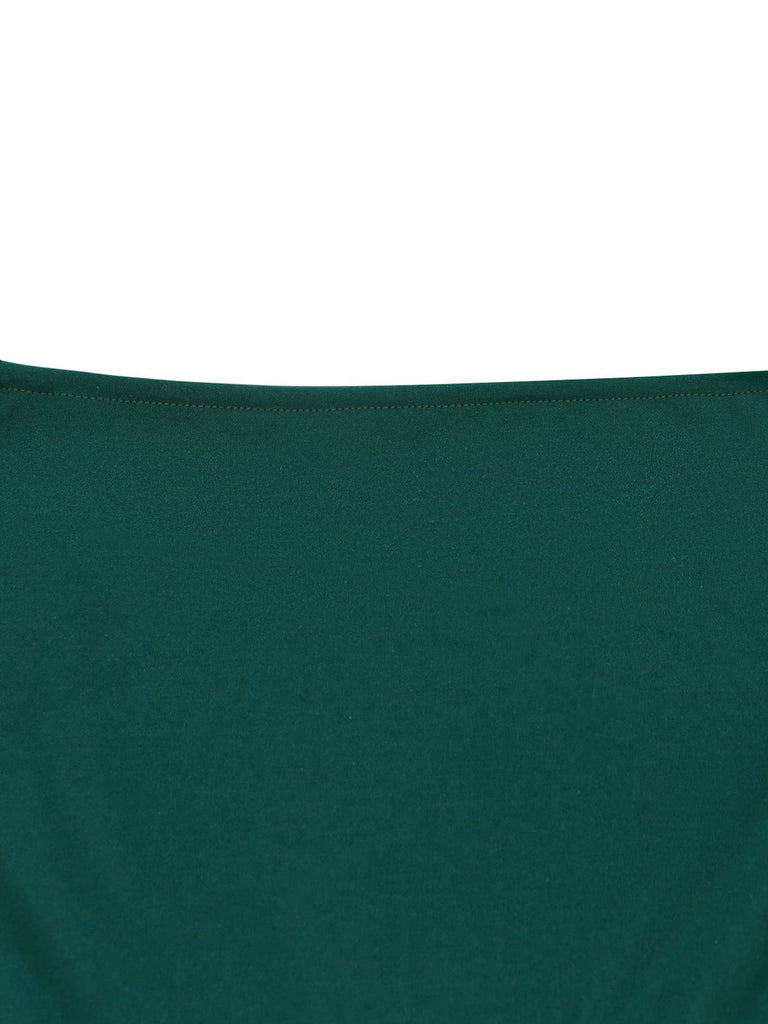 Close-up of a dark green fabric texture on a white background