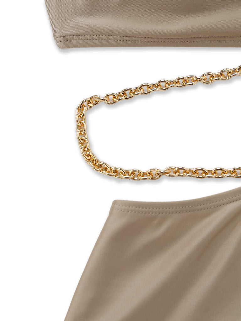 Halter cutout one-piece swimsuit chain detail featuring metallic accent for luxurious resort poolside style