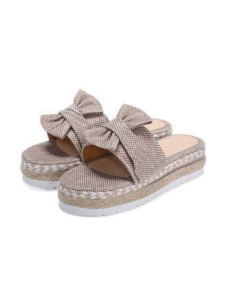 She's wearing Khaki Knitted Bow Platform Beach Sandals and the whole beach remembers the vintage