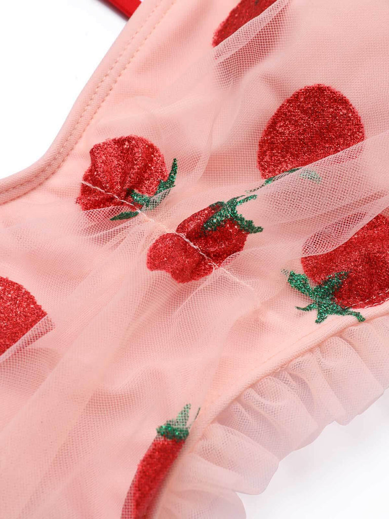 She's wearing Lace Strawberry Cami Tankini Set and the whole beach remembers the vintage