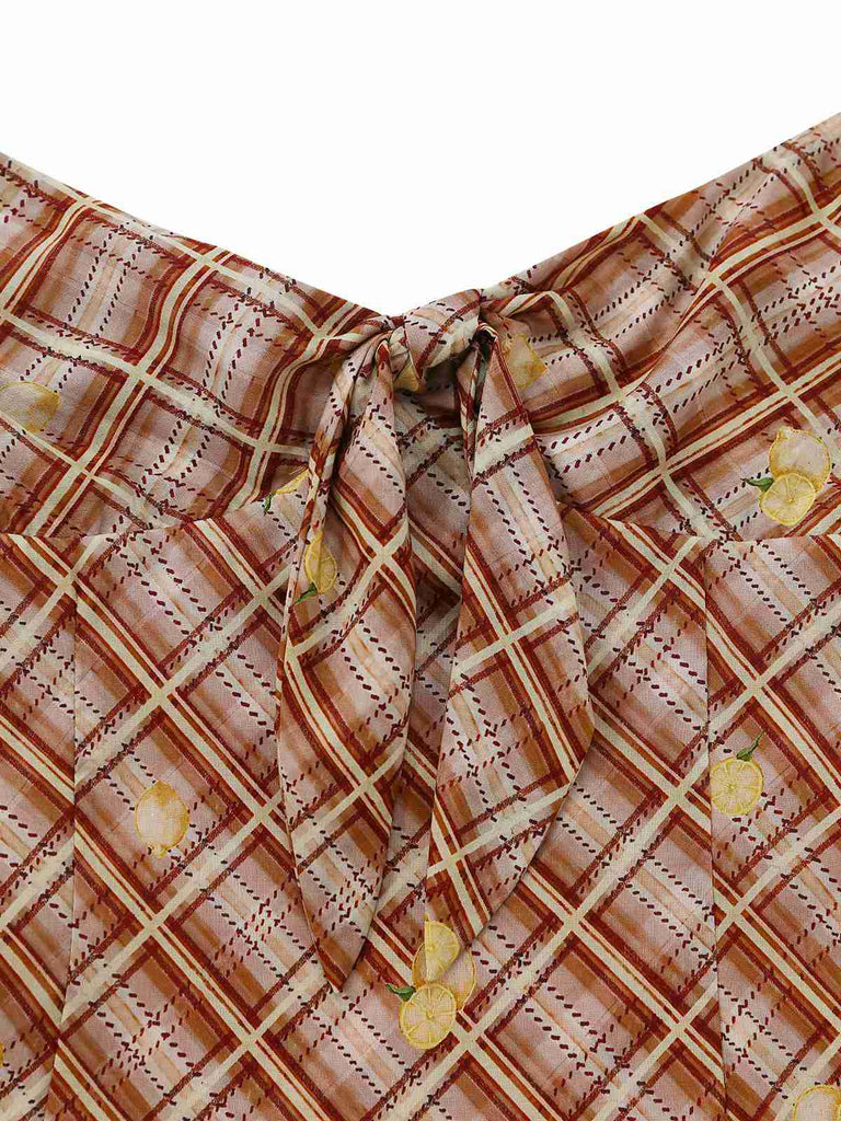 Plaid patterned fabric with a knot and yellow accents on a white background
