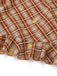 Close-up of a plaid fabric with lemon patterns on a white background