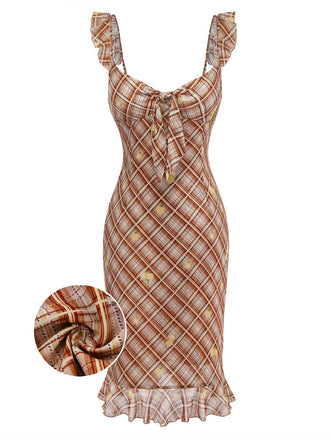 Plaid patterned dress with a close-up of fabric texture on a white background