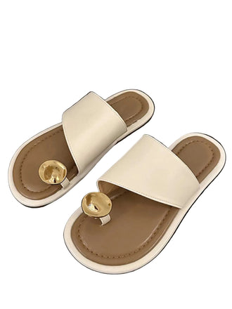 She's wearing Metal Thumb-Toe Beach Sandals and the whole beach remembers the vintage