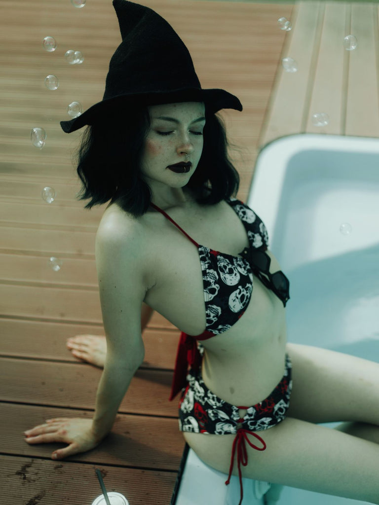 She's wearing Multicolor 1950s Skull Halter Swimsuit and the whole beach remembers the 1950s