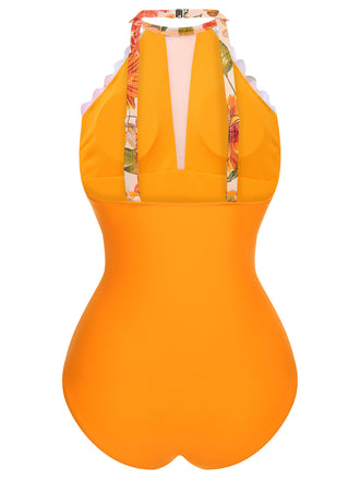 This Orange 1960s Halter Floral One-Piece Swimsuit carries 1960s vacation dreams in every stitch