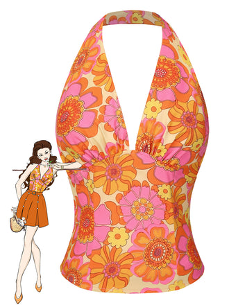 She pairs this Orange 1960s Hippie Floral Halter Top with confidence and 1960s charm