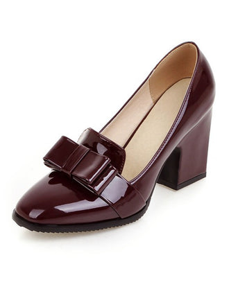 She finds her vintage story in this Patent Leather Bow Shiny High Heels