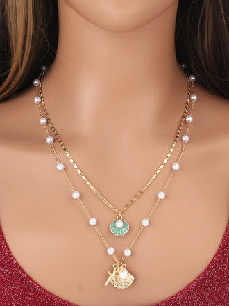 She adds this Pentagram Shell Necklace and suddenly it's vintage perfection