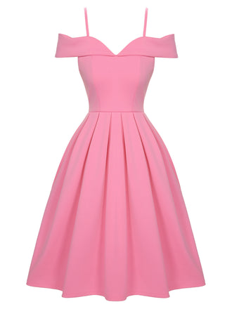 She slips into this Pink 1950s Cold Shoulder Solid Dress and suddenly it's a 1950s daydream