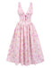 She slips into this Pink 1950s Deep V-Neck Lace-Up Floral Dress and suddenly it's a 1950s daydream