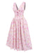 This Pink 1950s Deep V-Neck Lace-Up Floral Dress wraps her in 1950s elegance, one twirl at a time