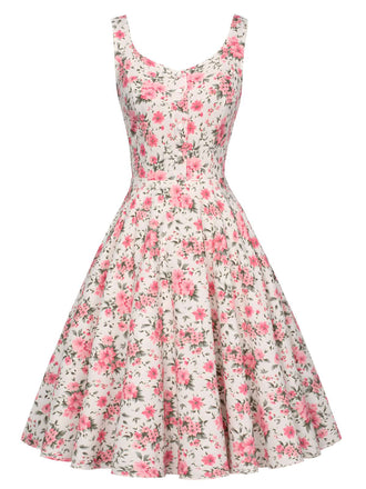 She slips into this Pink 1950s Ditsy Floral Smocked Dress and suddenly it's a 1950s daydream