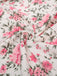 This Pink 1950s Ditsy Floral Smocked Dress wraps her in 1950s elegance, one twirl at a time