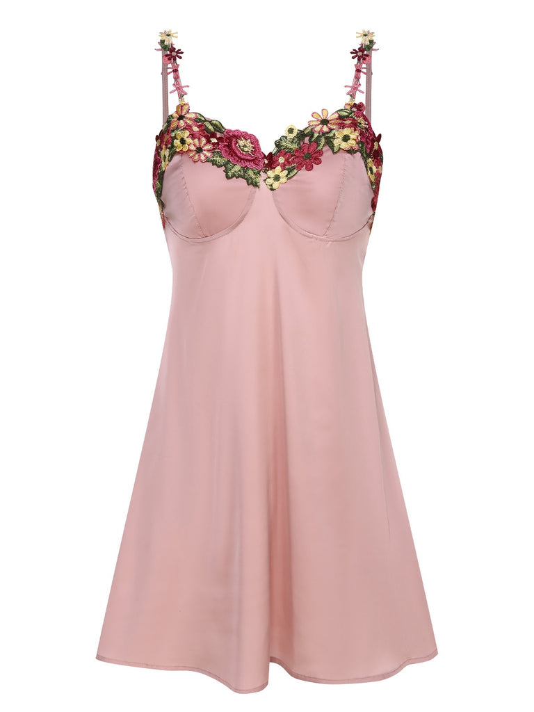 She slips into this Pink 1950s Flower Embroidered Suspender Nightgown and suddenly it's a 1950s daydream