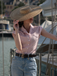 She pairs this Pink 1950s Gingham Plaid Lapel Shirt with confidence and 1950s charm