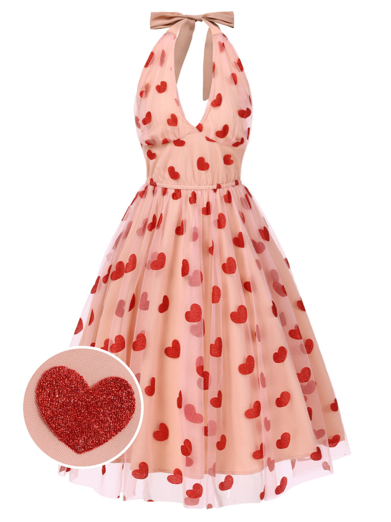 She slips into this Pink 1950s Halter Heart Mesh Dress and suddenly it's a 1950s daydream