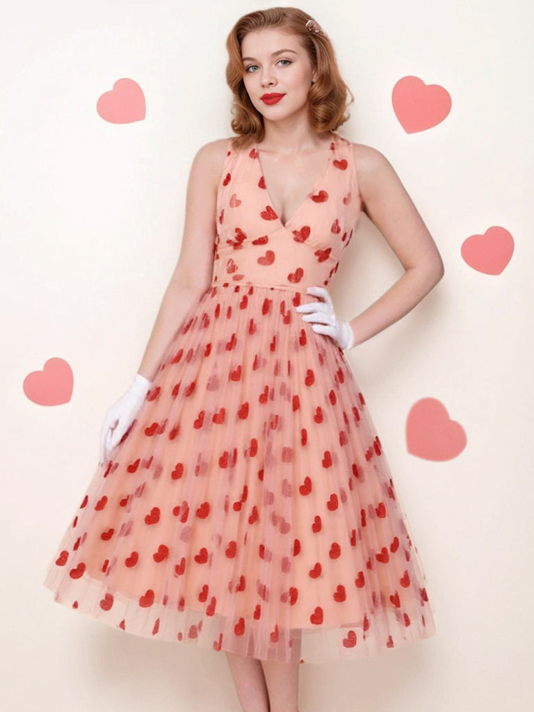 This Pink 1950s Halter Heart Mesh Dress wraps her in 1950s elegance, one twirl at a time