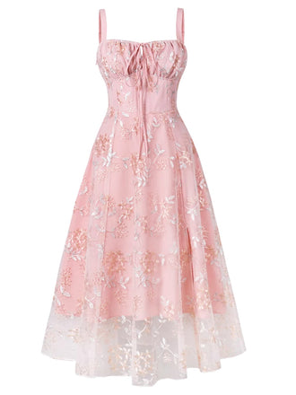 She slips into this Pink 1950s Lace-Up Straps Floral Mesh Dress and suddenly it's a 1950s daydream