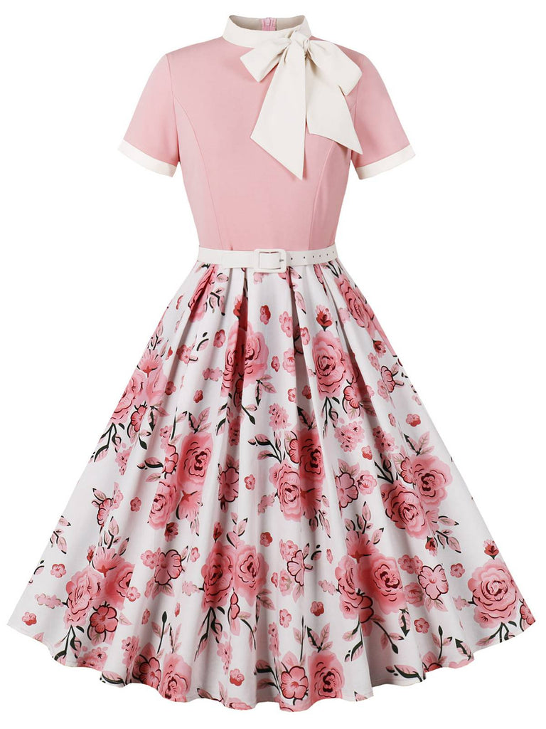 She slips into this Pink 1950s Rose Patchwork Tie Collar Dress and suddenly it's a 1950s daydream