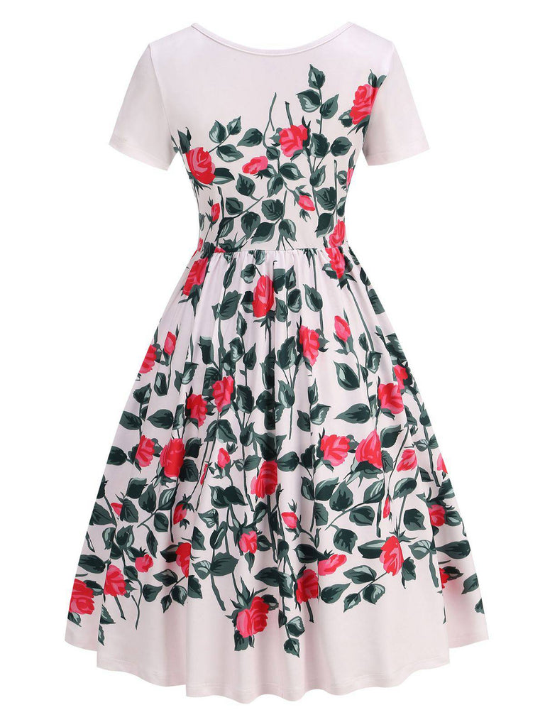 White dress with red floral pattern on a white background