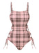 She's wearing Pink 1950s Side Hollow Lace-Up Plaid Swimsuit and the whole beach remembers the 1950s