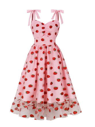 She slips into this Pink 1950s Spaghetti Strap Bow Strawberry Dress and suddenly it's a 1950s daydream