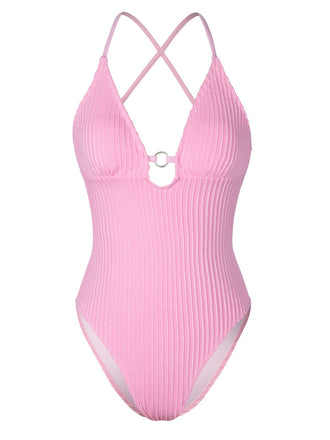 She's wearing Pink 1950s Spaghetti Strap High-Leg Solid Swimsuit and the whole beach remembers the 1950s