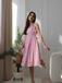 She slips into this Pink 1950s Spaghetti Strap Plaid Swing Dress and suddenly it's a 1950s daydream