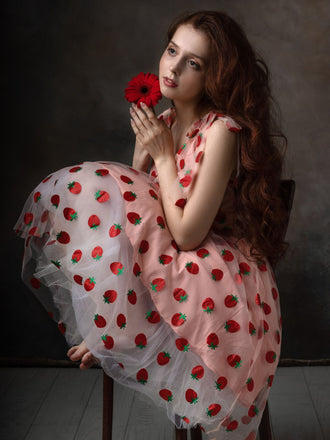 She slips into this Pink 1950s Strawberry Mesh Swing Dress and suddenly it's a 1950s daydream