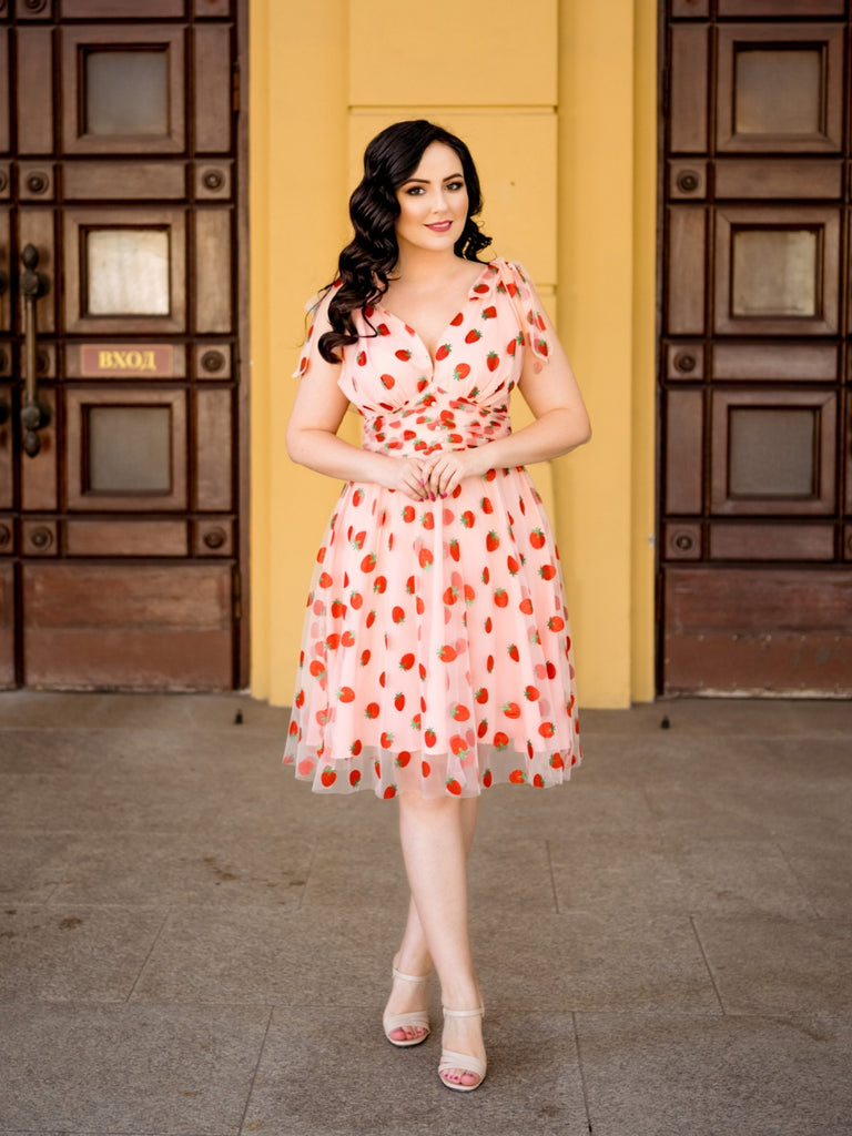 She slips into this Pink 1950s Strawberry Mesh Swing Dress and suddenly it's a 1950s daydream